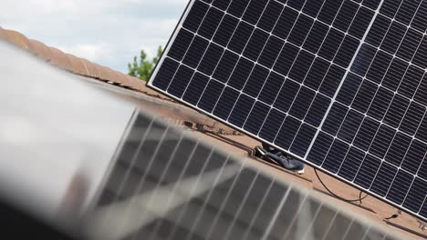 consumer solar panel being installed on customer's house roof, sustainable energy