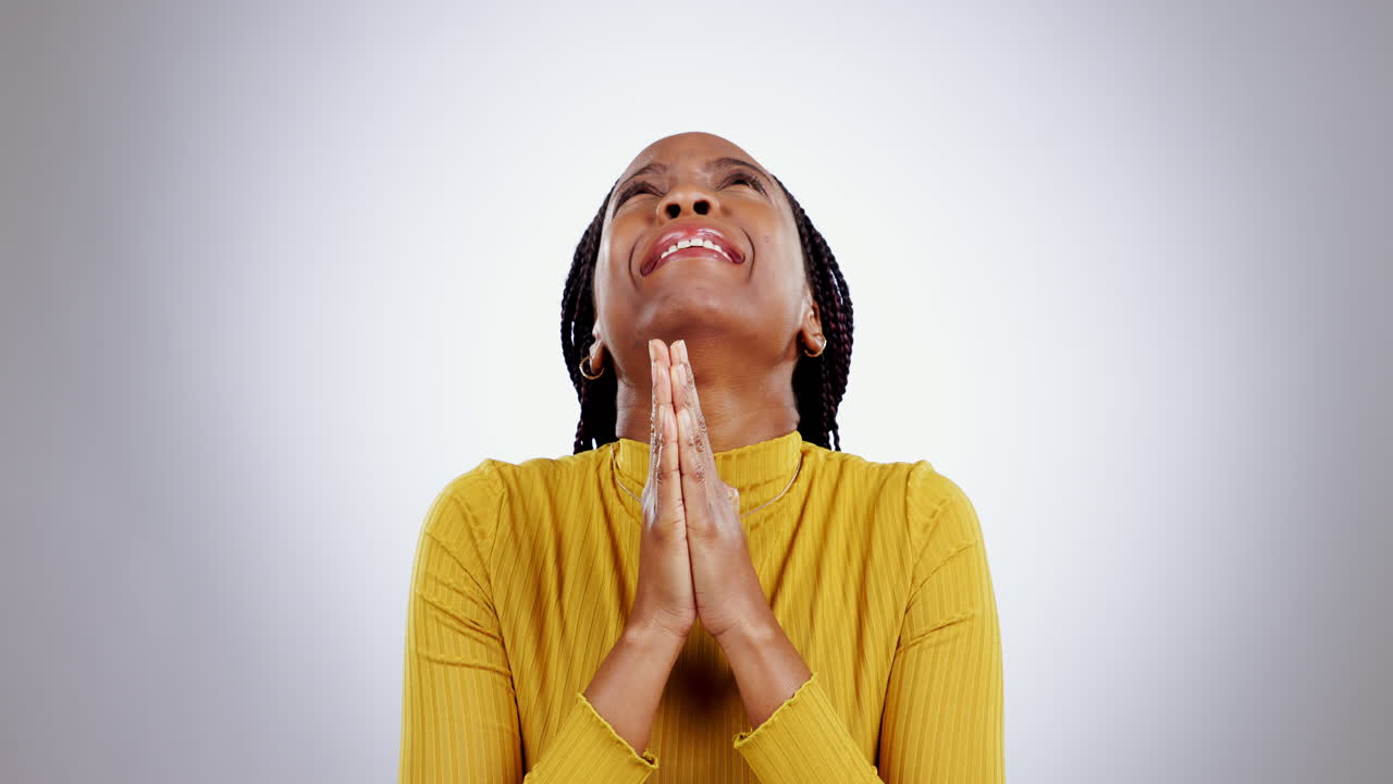 Praying hands, help and black woman in studio
