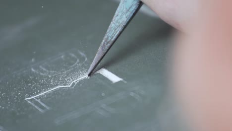 carving stone in slow motion