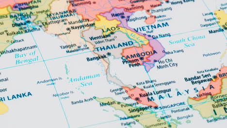 close-up of the country word thailand on a world map with the detailed name of the capital city