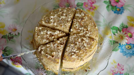 close-up of a cake cutting with a large knife view from above