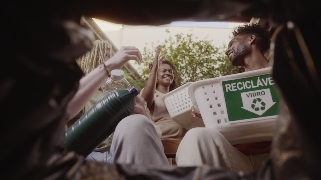 Friends Happily Recycling Plastic and Glass Waste Together
