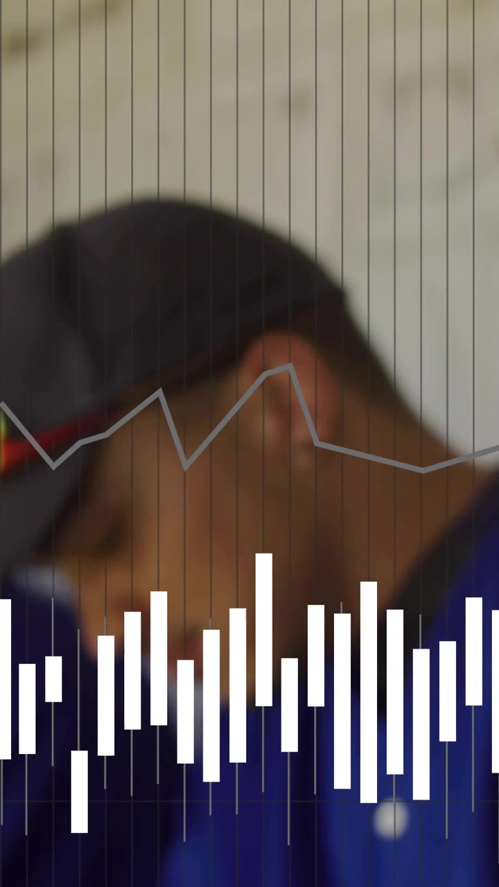 Vertical video: Audio bars fluctuating, sportsman with cap tilting head and focusing downward