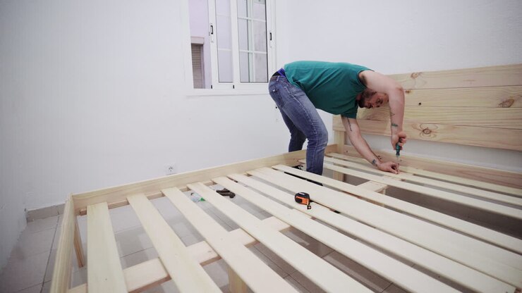 Fixing furniture bed screws manually hispanic guy