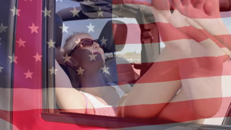 Animation-of-flag-of-usa-over-caucasian-woman-in-car-on-beach