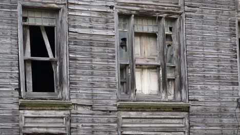 old wooden building with broken windows