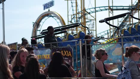 people enjoying rides at a lively amusement park