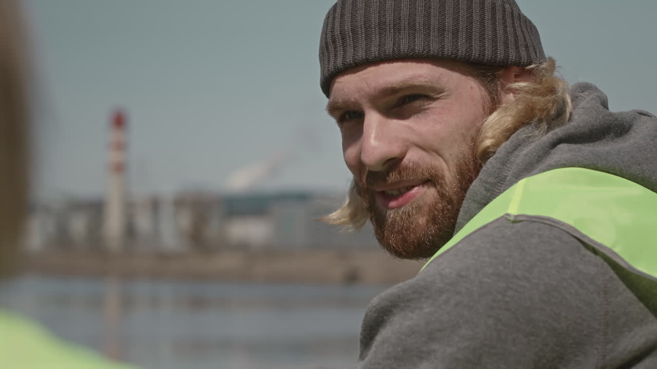 Environmental Volunteer Talking with Friend Outdoors