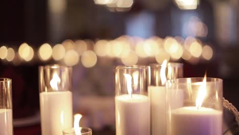 decorative candles burning on a banquet table