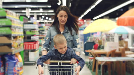mother and son having fun at the grocery store