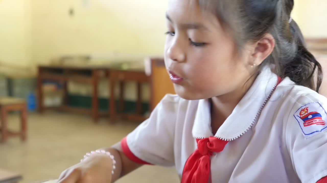 Young Cambodian Schoolgirl Eating Lunch
