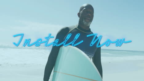 holding surfboard on beach, man standing with install now text overlay