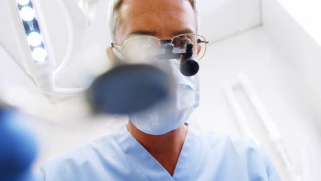 dentist holding dental tool