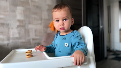 baby boy in high chair