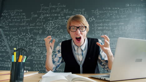 Frustrated Student/Teacher with Laptop in Classroom