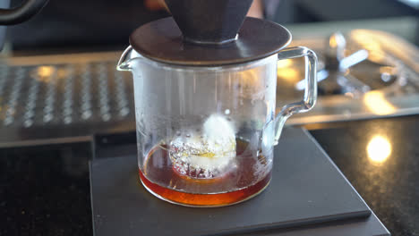 pouring hot water for dripping arabica coffee