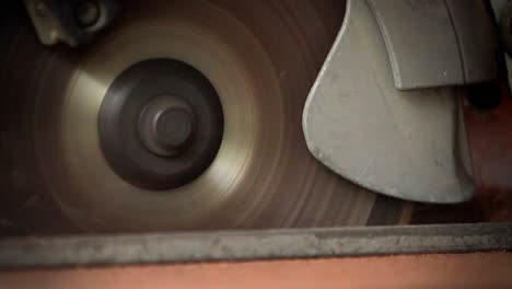 a circular saw cutting through wood at a workbench