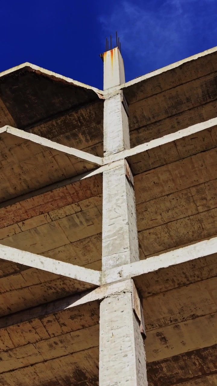 Structural design of concrete building in aerial view under clear sky