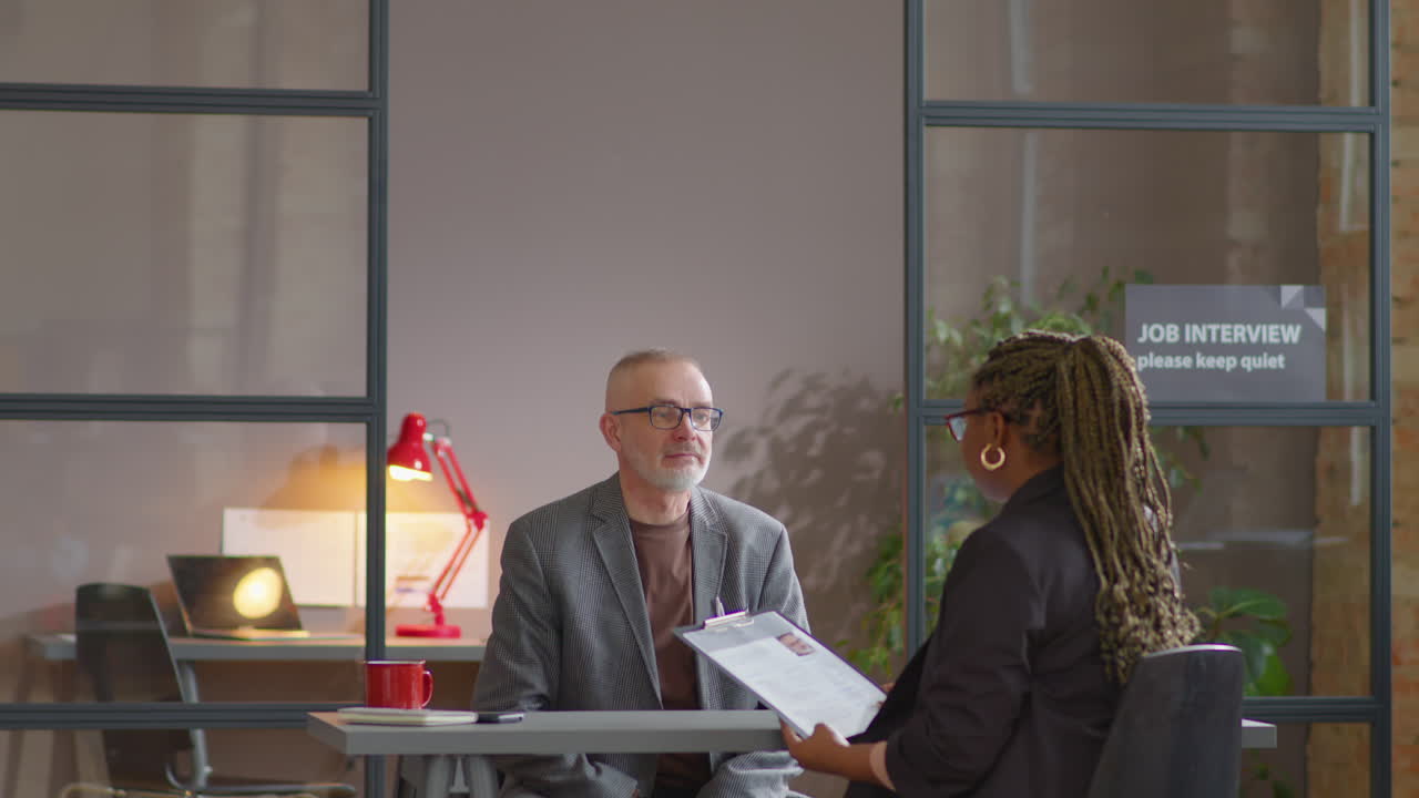 Senior Man Having Job Interview with Female Recruiter