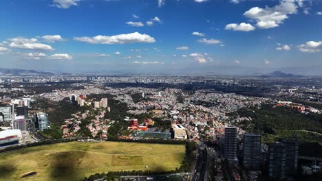 aerial view overlooking the cityscape of santa fe, sunny day in mexico city