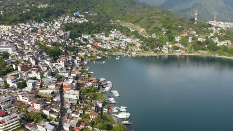 Aerial-ascend-above-Lake-Atitlan-Guatemala-bay-on-calm-serene-day
