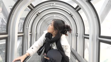 Female-tourist-Enjoying-Osaka's-Iconic-Escalator-at-Umeda-Sky-Building-in-Japan