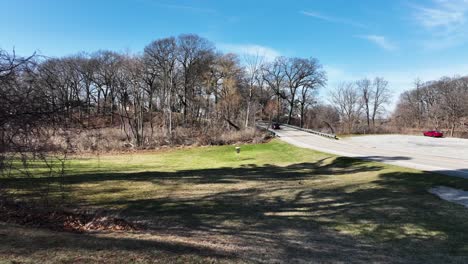 Pushing-toward-the-yellow-and-metal-Disc-Golf-Pin