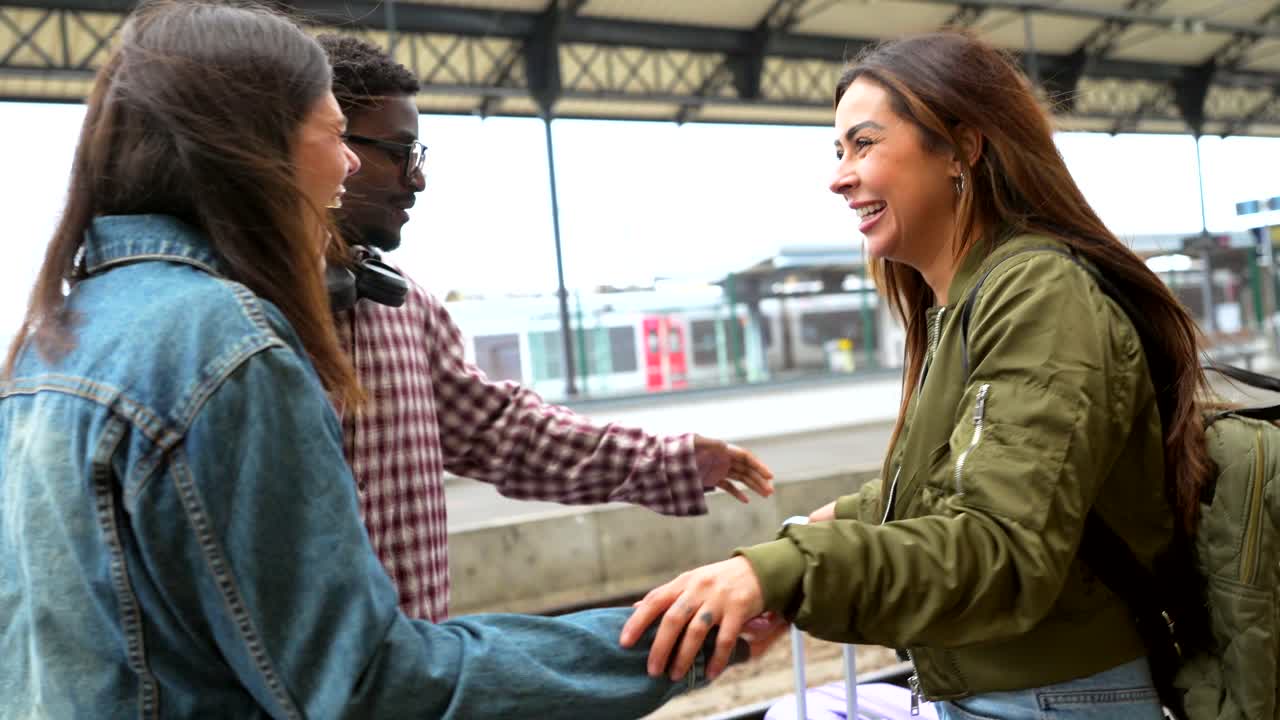Friends Reuniting at Train Station