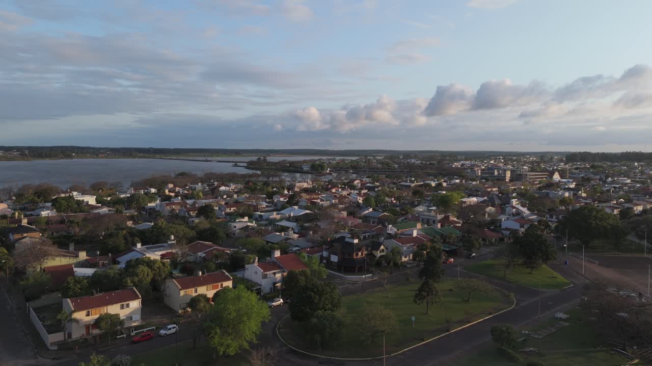 Aerial View of a Residential Town by the Lake at Sunset