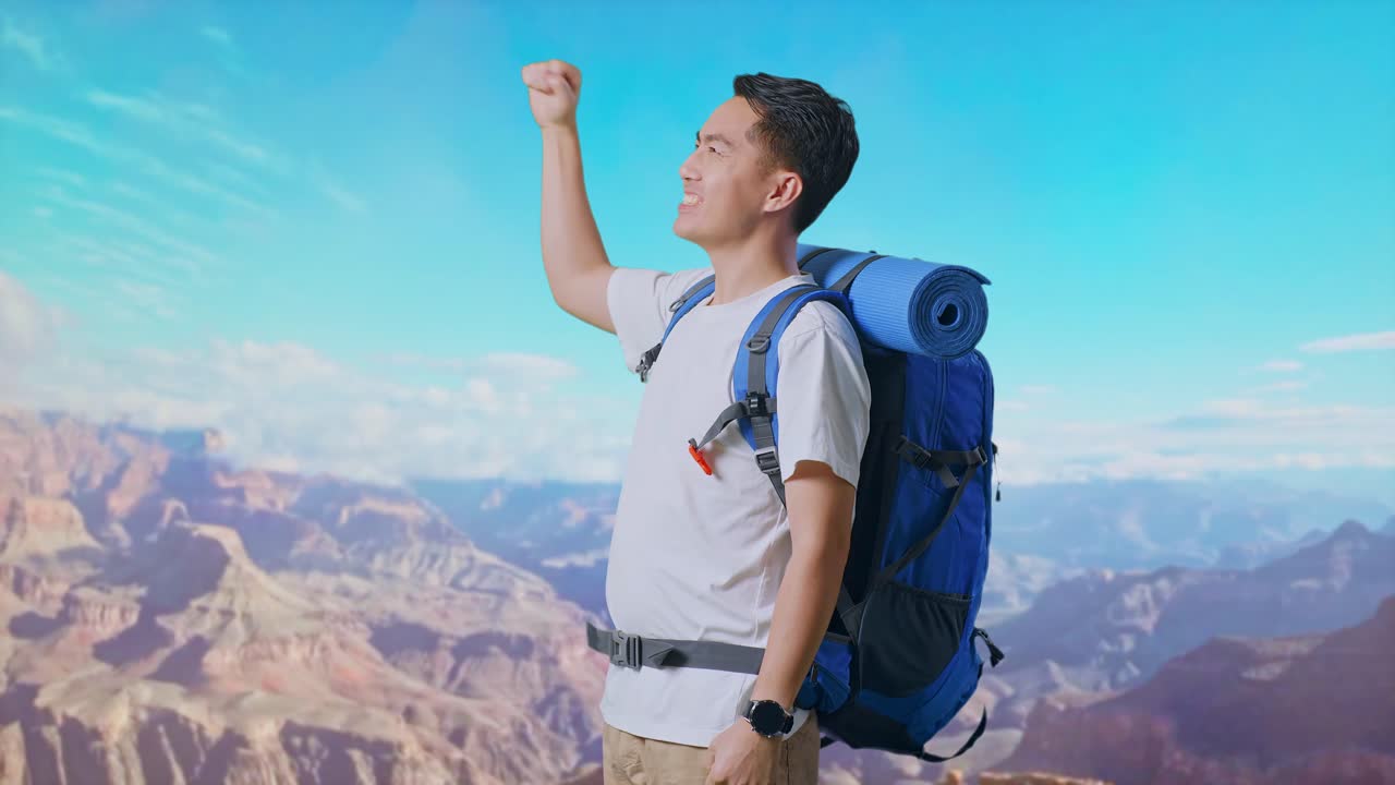 Side View Of Asian Male Hiker With Mountaineering Backpack Screaming Goal Celebrating The Success While Traveling At The Top Of Mountain