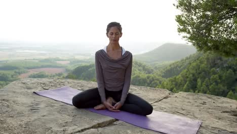 woman doing yoga outside 48