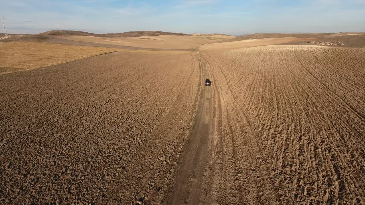 An Offroad Vehicle Driving Through the Landscape