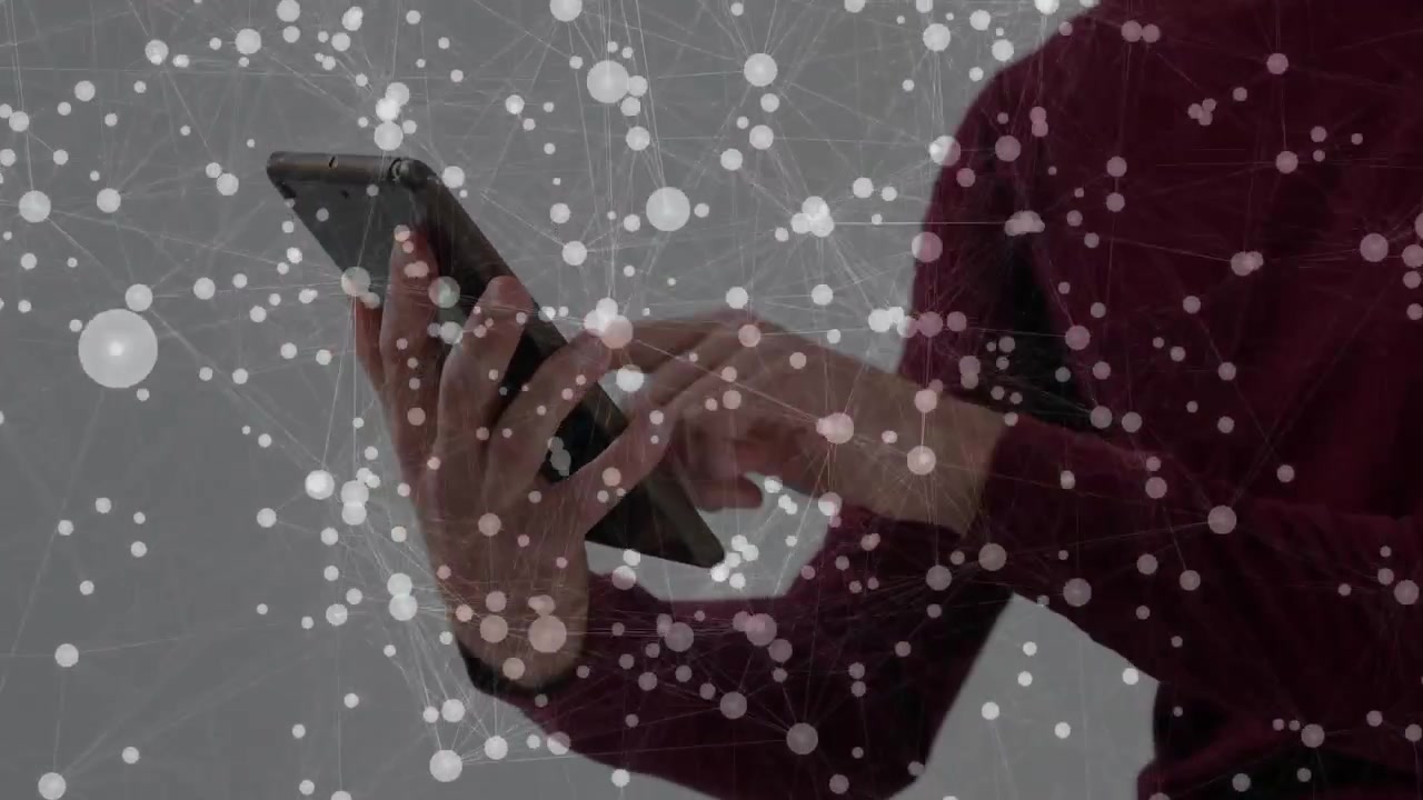Male user raising tablet and tapping touchscreen, generating animated network overlay for tech demo