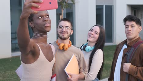 multiethnic group of friends taking a selfie outdoors