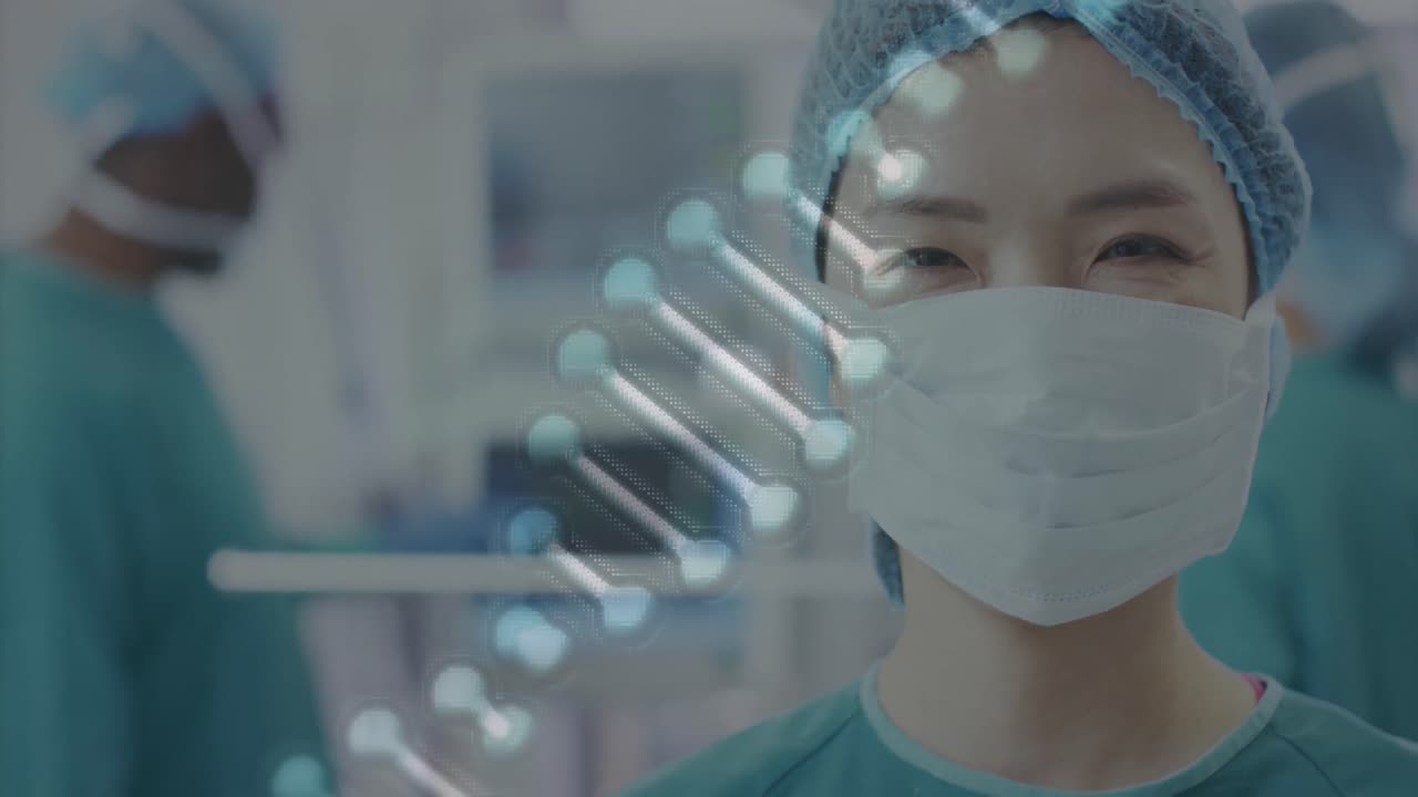 Animation of dna strand over portrait of smiling asian female surgeon in operating theatre