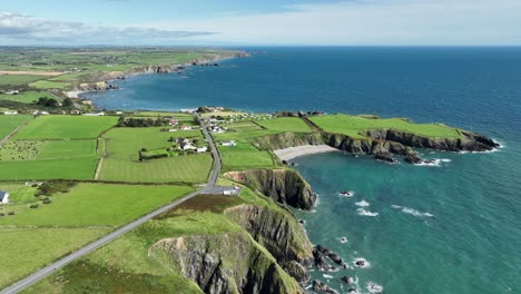 Coast-Ireland-establishing-shot-of-the-Copper-Coast-Drive-Waterford-winding-along-the-spectacular-coast-at-Boatstrand-on-a-summer-day