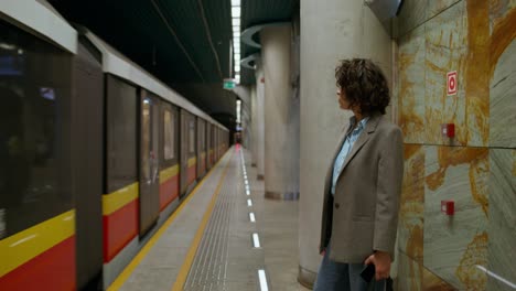 woman waiting for subway train