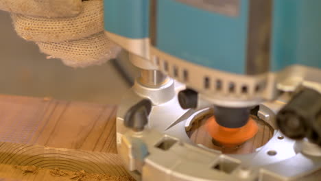 Brushless-compact-router-smoothening-the-edge-of-a-drilled-hole