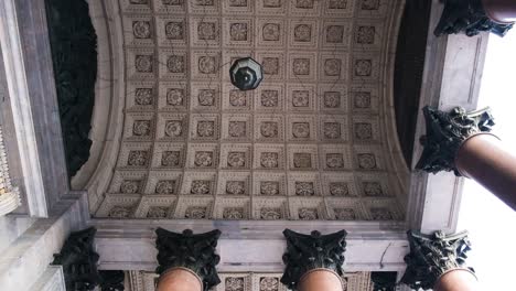 ornate ceiling and columns of a historical archway