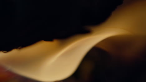 Slow-motion-shot-of-flames-and-embers-in-a-fireplace