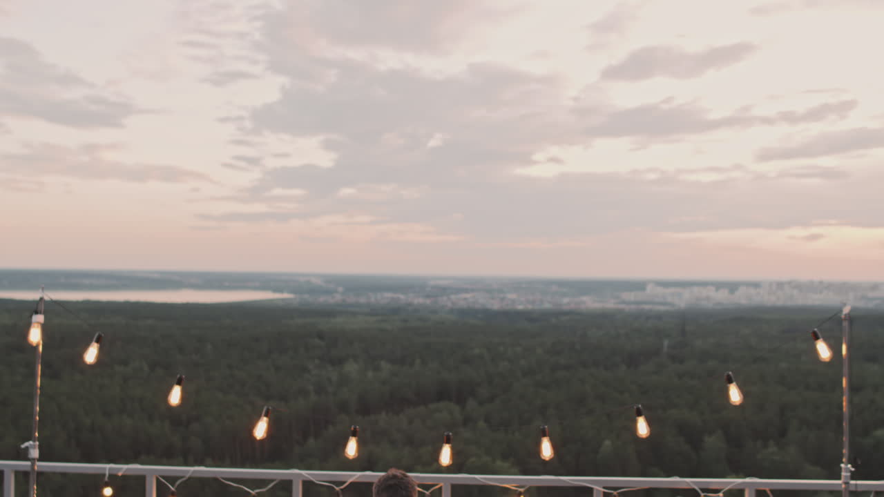 DJ Playing Music and People Partying on Rooftop