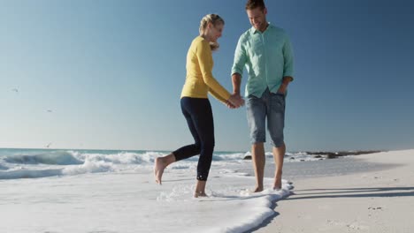 couple in love enjoying free time on the beach together