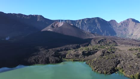 Approaching-the-inner-crater-cone-of-Mount-Rinjani-active-volcano-in-Indonesia,-Nusa-Tenggara,-Aerial-dolly-in-shot