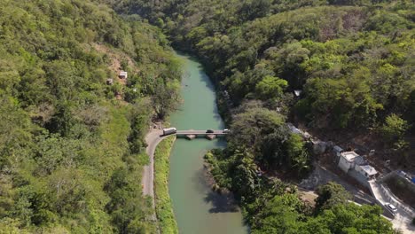 drone fly backward while car cross over flat bridge