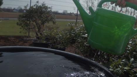 gardner filling the can with water