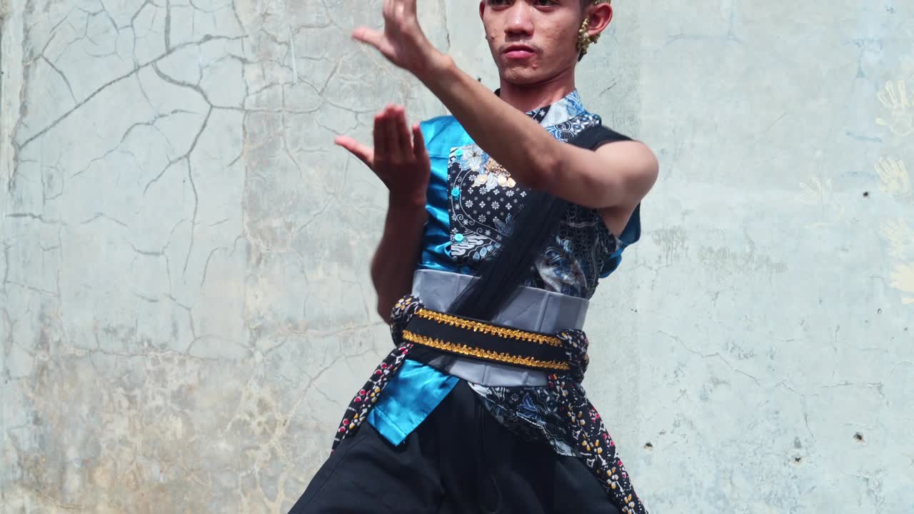 Young man performing jaipong dance