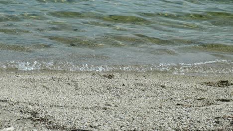 Captivating-footage-of-waves-gently-breaking-on-the-serene-shores-of-Lake-Manapouri