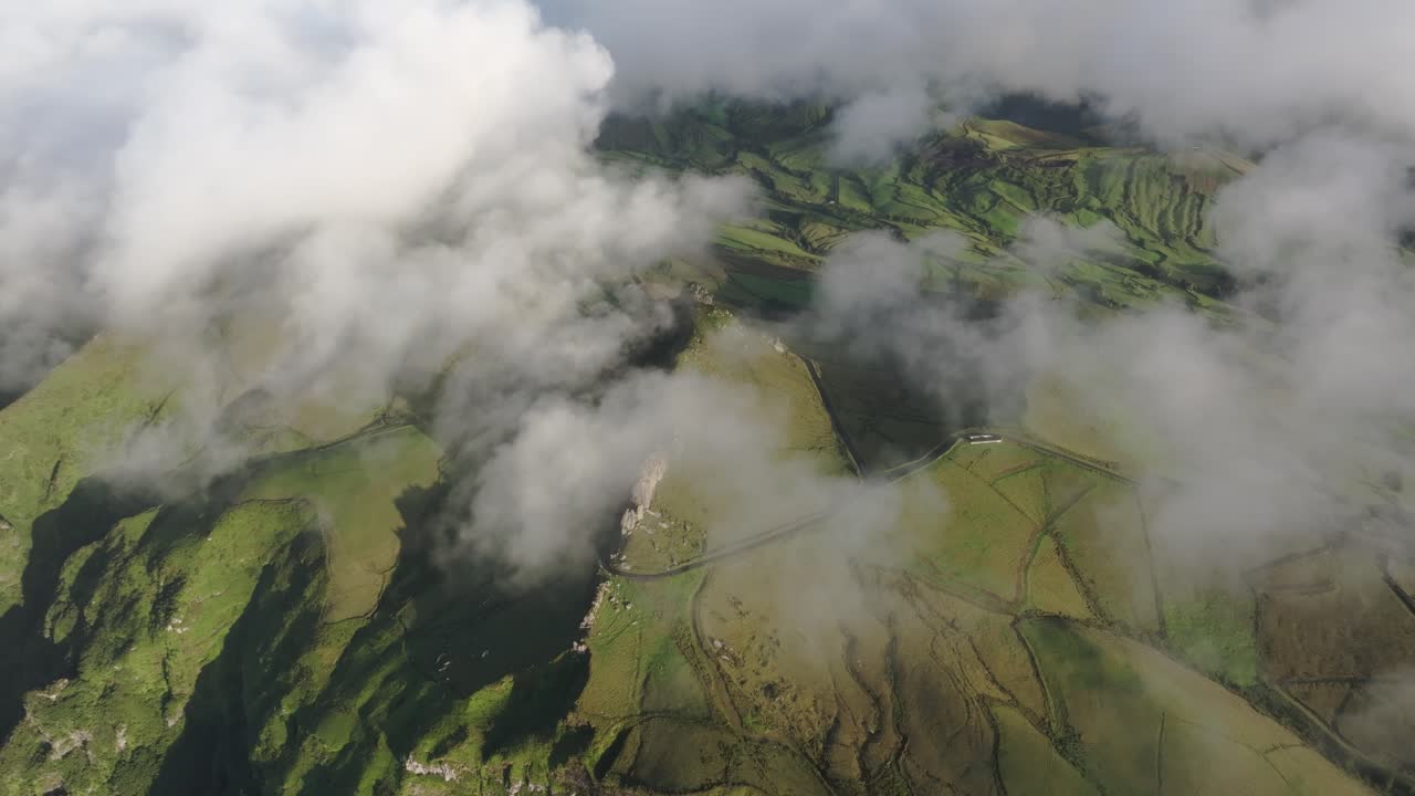 Flying above low clouds at flores island Azores - drone shot