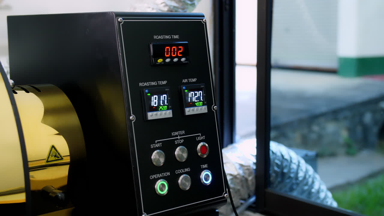 Hand Of Worker Pushing Button On Control Panel To Start Work Of Coffee Roaster