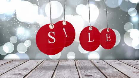 Red-sale-tags-hanging-against-glowing-background